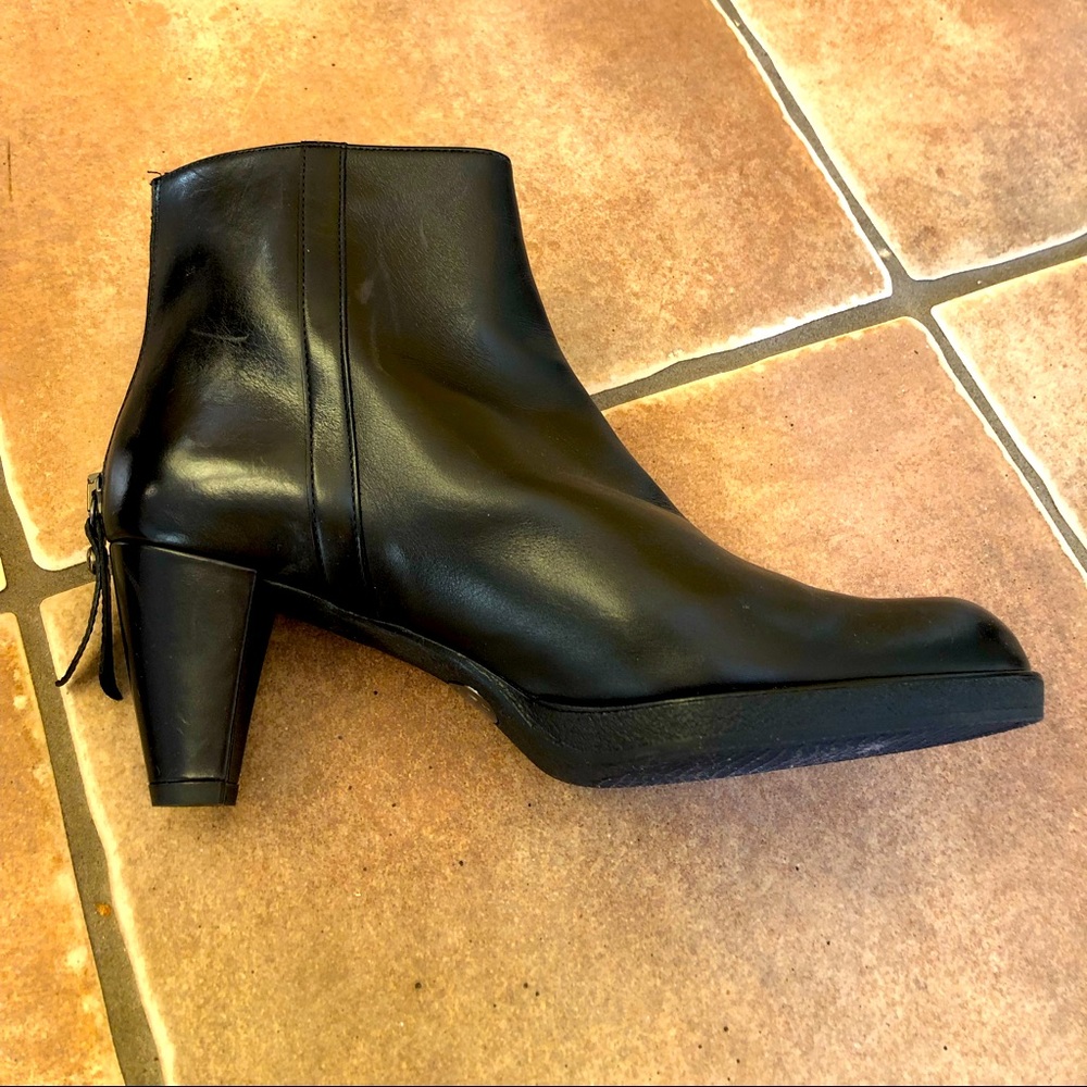 Black Stuart Weitzman ankle boots.